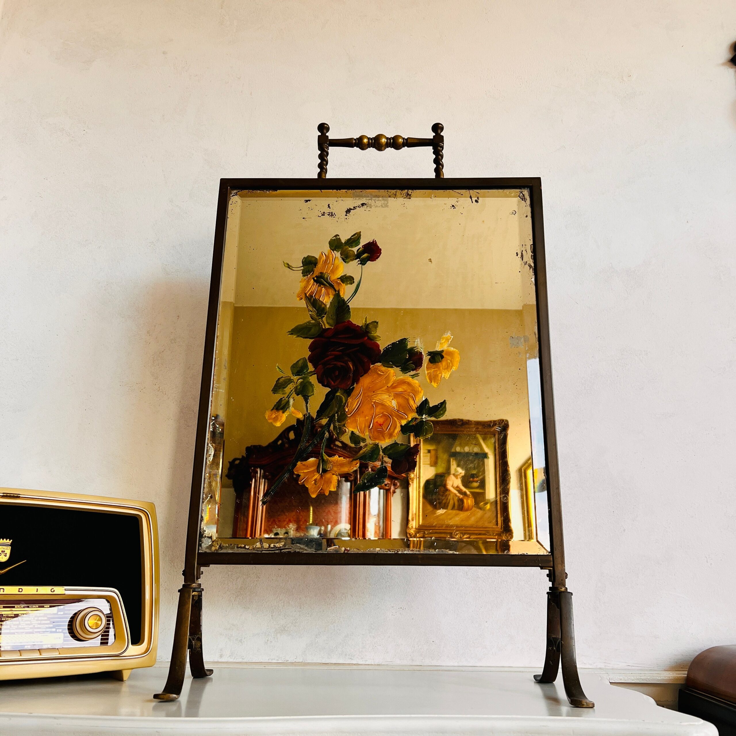 4c9332cb-ac98-5e5e-a84e-900d5015322f.jpg Victorian Brass Fireplace Screen with Beveled Mirror and Hand Painted Floral Motif - Image 1