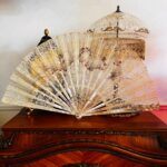 An exquisite antique hand-painted fan with cherubs, dating back to 19th Century fan made by Faucon of Paris France