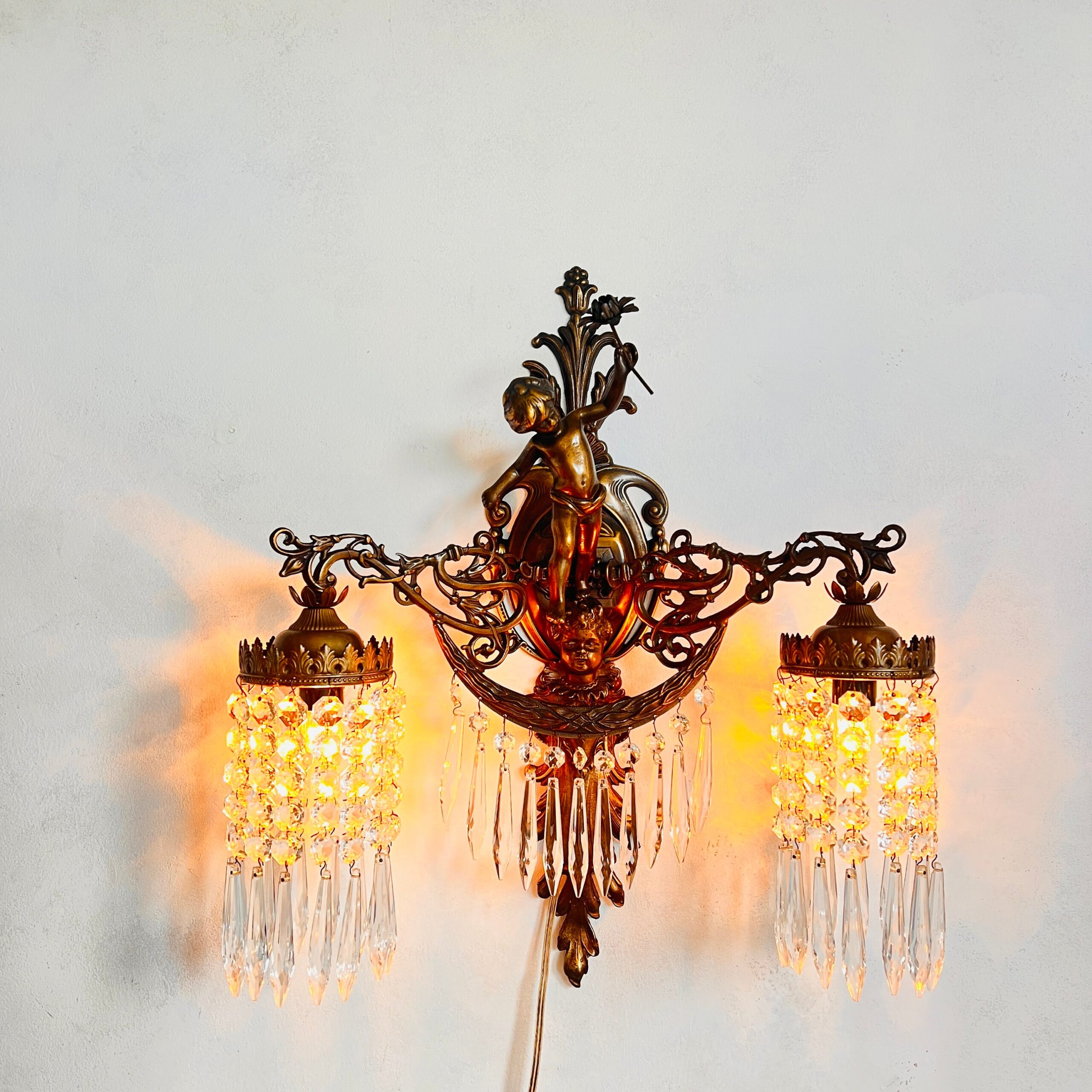 9ab238eb-ad26-58aa-b789-49a3c1419c97.jpg French Putti Wall Sconce – Dual Arm Light with Crystal Shades, Rococo Style Accent - Image 1