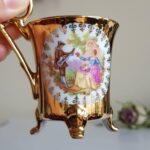 Vintage 4 Feet Demitasse Cup and Saucer, Fragonard Scenes, Fine Porcelain 22 Karat Gold - Image 3
